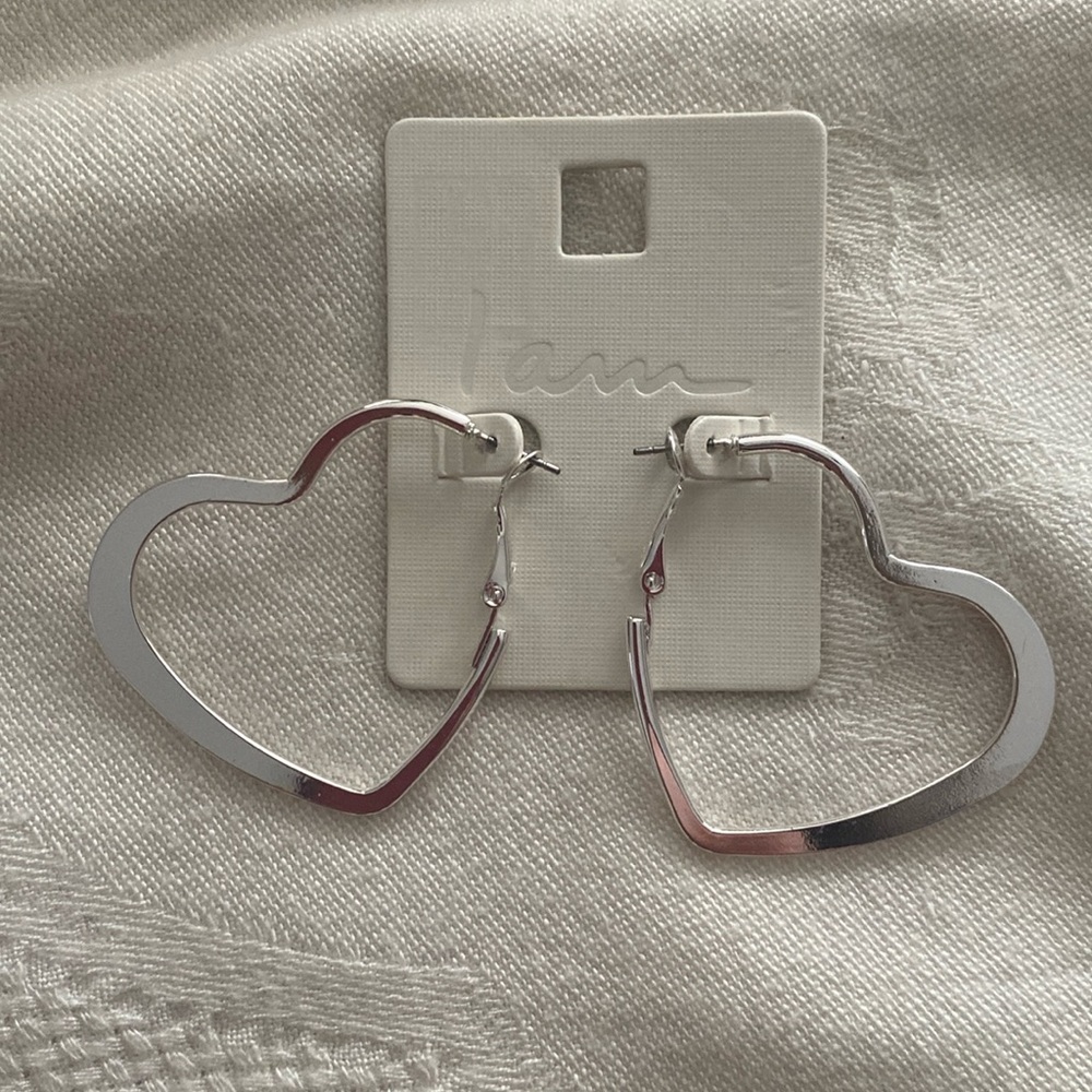 NWT silvertone heart earrings. Perfect for Valentine’s Day or anytime.